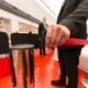 Side view of a member of security personnel closing the gate at a red carpet event