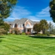 Large modern brick house with colonial style balcony
