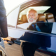 Senior business man sitting in his limousine