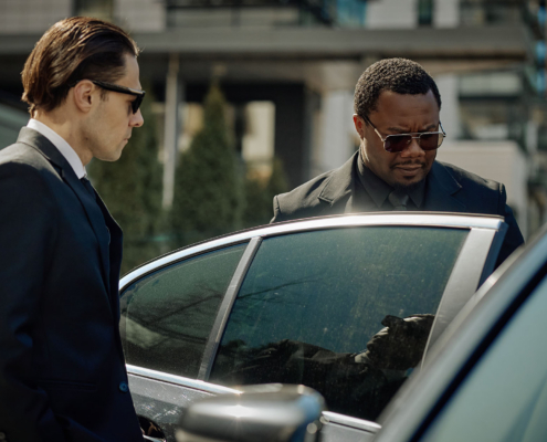 Executive getting into a car