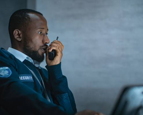 Security worker talking in walkie talkie